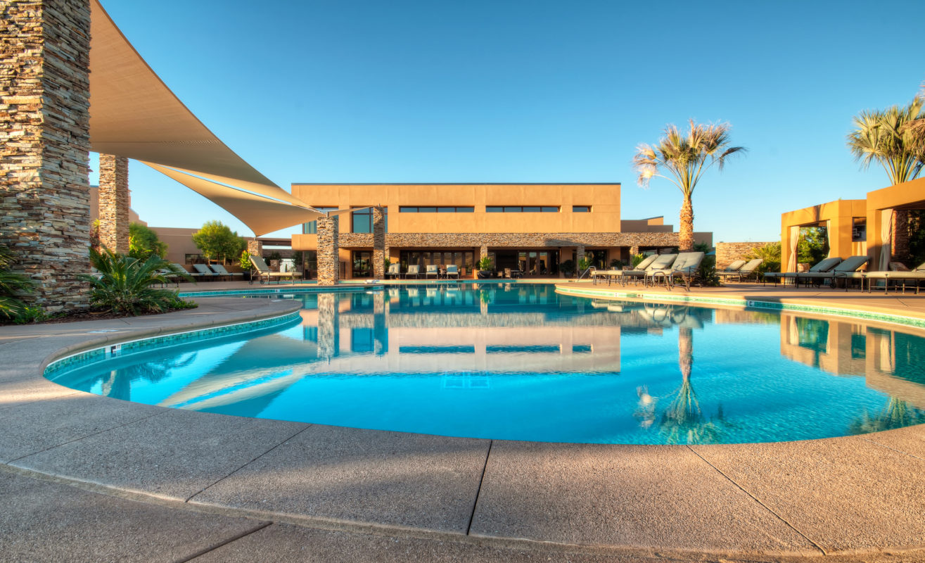 A pool with a building in the background