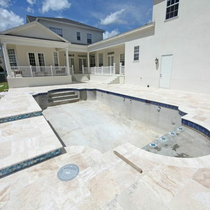 A pool that is in the middle of a yard.